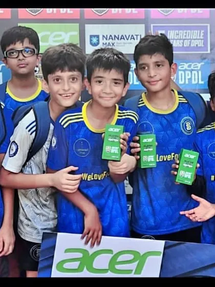 The U11 team celebrating their Player of the Match awards after a fantastic performance in the league.