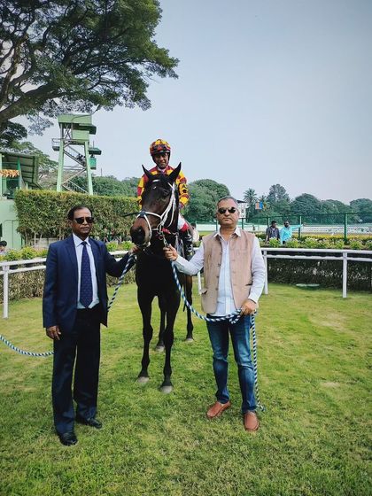 Divine Art, with jockey Suraj Narredu, after winning the memorial trophy.