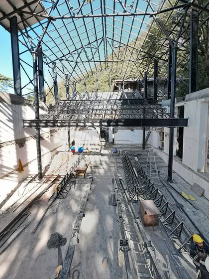 A glimpse into the complex structural retrofit of Parker Hall at Woodstock School. This image showcases the engineering and innovation required to adapt a heritage building into a modern performance space, balancing technical challenges with conservation concerns.