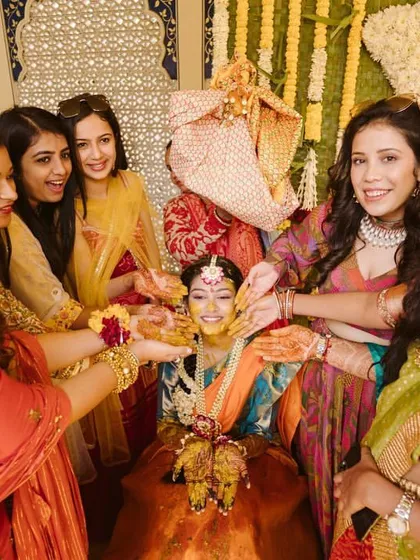 A joyful Haldi moment with the bride surrounded by her bridesmaids. These are the memories that will be cherished for a lifetime.