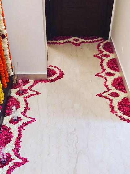 A beautiful and intricate walkway border made from fresh flower petals. This adds a special touch to the entrance of any home event.