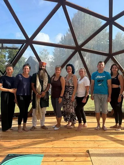 A group of seekers in Lithuania, ready to begin their yoga journey. It doesn't matter your age or background; yoga is a gift for everyone.
