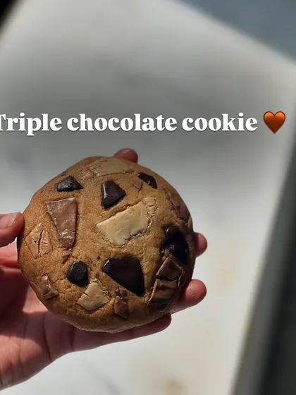 For the ultimate chocolate lover, the Triple Chocolate cookie. It's made with dark, milk, and white chocolate for a complex and rich flavor.