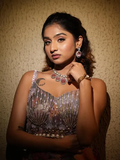 A closer look at the Sangeet makeup. The skin is glowing, and the eyes are defined with a soft wing and full lashes.