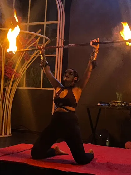 A moment of power and focus during a fire staff performance. This shot captures the intensity and artistry I bring to the stage, creating a dramatic centerpiece for any event.