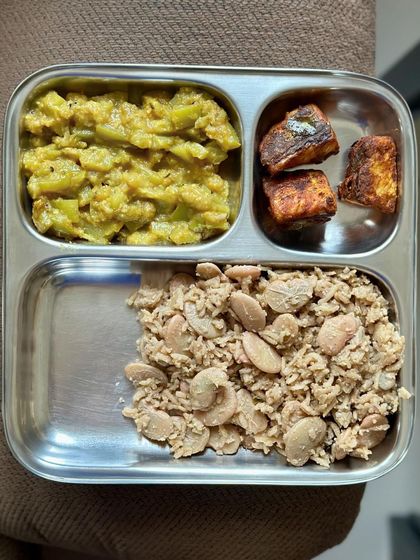 This unique plate features lima bean rice, sautéed bottle gourd, and pan-fried paneer.