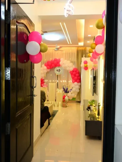 A view from the entrance of a home where I set up a Chhathi ceremony decoration. The balloon arch and bright lighting create a welcoming and festive atmosphere right from the door.