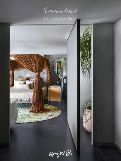 The entrance to the master bedroom in Project 86 is a stunning 5-foot-wide pivoting glass door. It’s designed to look like a simple partition wall but opens to reveal the incredible cabana bed inside.