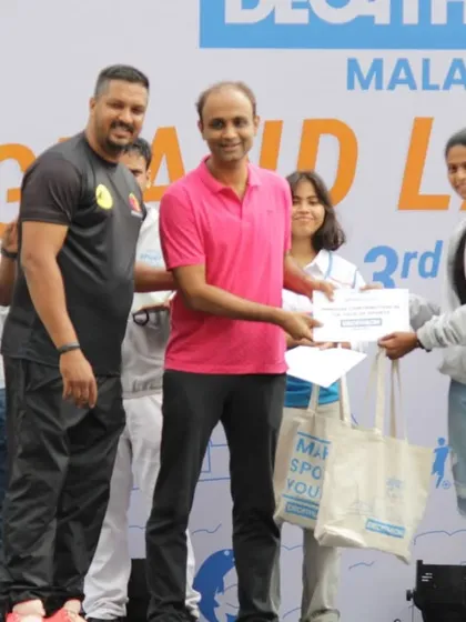 Another happy participant receiving their award on stage. Recognizing achievement is a key part of the positive and encouraging atmosphere we create at our events.