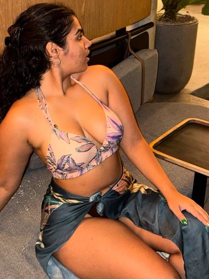 A close-up of the poolside look. The tropical print and colors are perfect for a Bali vacation.