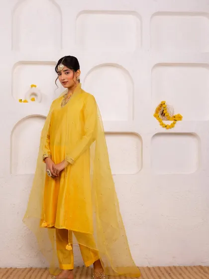 This sunshine yellow suit is perfect for a Haldi ceremony or a festive day event. I kept the styling clean and elegant with a simple maang tikka to let the vibrant color shine.
