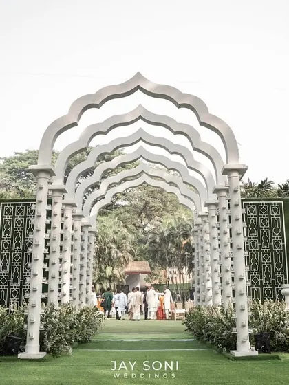 First impressions are everything. I designed this dramatic, all-white architectural walkway to create a sense of awe and anticipation, guiding guests into a celebration that was both grand and elegant.
