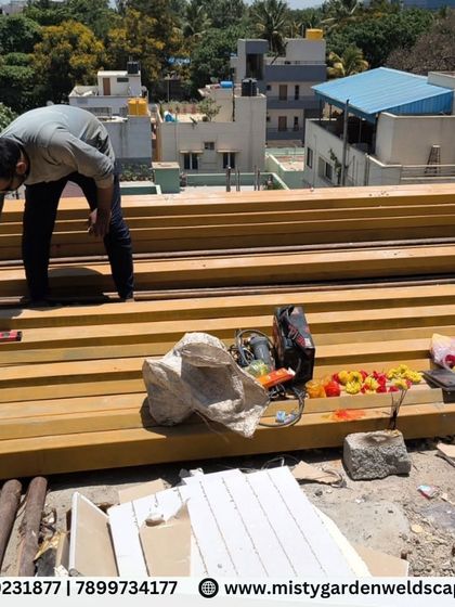 Preparing the metal beams on-site. Each piece is inspected and prepared before being lifted into place, ensuring quality control at every step of the process.