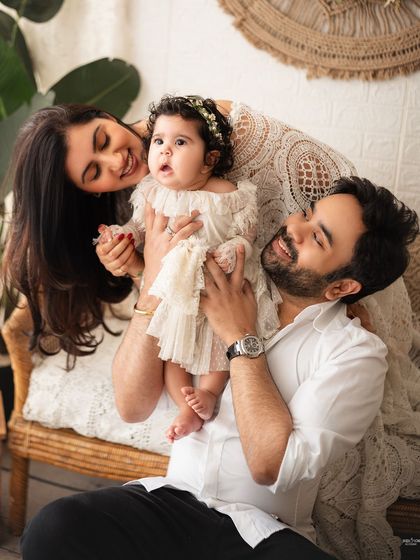 A playful and interactive family photo that is full of life and laughter.