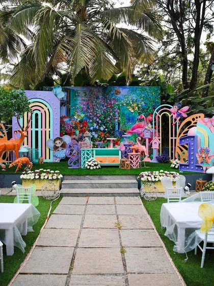A whimsical and colorful kids' birthday party setup. The enchanted forest theme, complete with fairies, deer, and flamingos, shows the creative possibilities at our venue.