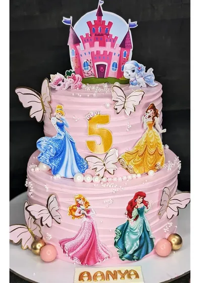 A princess dream come true with this two-tier black forest cake. It features all the classic Disney princesses, a castle topper, and beautiful butterfly details for a magical 5th birthday.