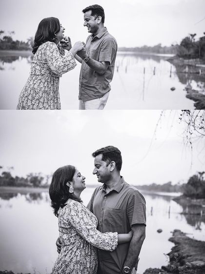 A black and white version of a couple's lakeside shoot, emphasizing the emotional connection and playful moments between them.