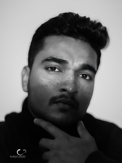 A striking black and white male portrait with a motion blur effect. The image feels raw and full of energy, capturing a fleeting moment of intensity.