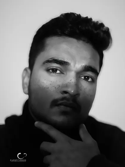 A striking black and white male portrait with a motion blur effect. The image feels raw and full of energy, capturing a fleeting moment of intensity.