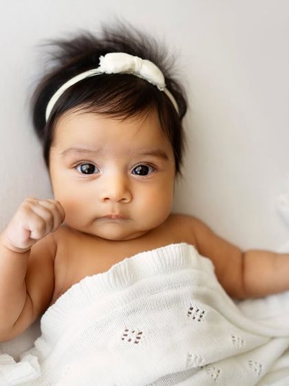 This little 4-month-old squishy is just too cute. I love the simplicity of this shot, with the focus entirely on her sweet face.