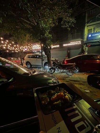 Setting the scene for a perfect evening in with Degnama. This shot captures the ambiance of enjoying great food in a casual, comfortable setting.