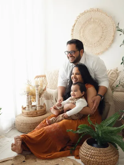 A relaxed family portrait in my bohemian studio setup. The natural textures and plants create a warm and inviting atmosphere.