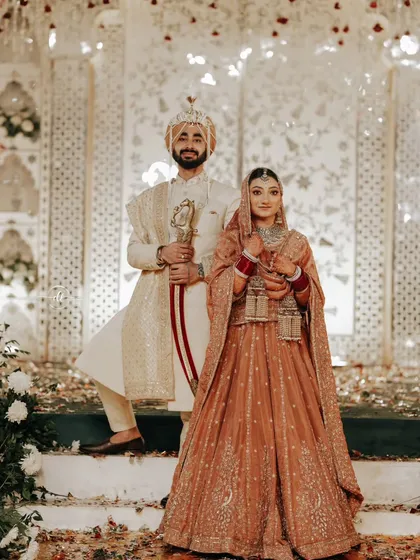A grand portrait of the Sikh couple. The bride's makeup is perfectly balanced, ensuring she looks radiant and elegant next to her groom.