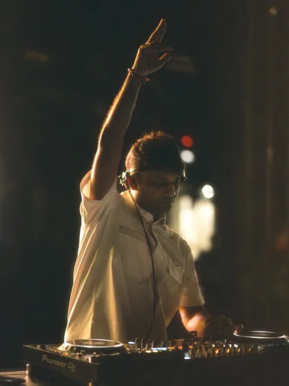 A focused shot of me at the decks during the IIM Bangalore campus tour show.
