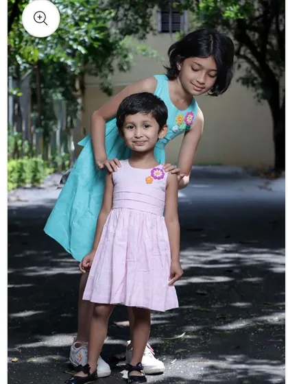 My handmade flower patches add a touch of charm to these girls' dresses. I can create custom patches to match any color or style you have in mind.
