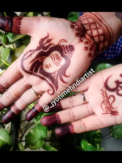 For religious festivals like Shrawan, I teach how to create spiritual designs. This one features a portrait of Lord Shiva on one palm and the Om symbol on the other.