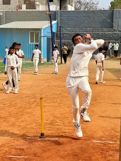 I believe in providing a realistic practice environment. This action shot captures a young bowler in full flight on our outdoor clay run-up, building the strength and rhythm needed for match day.