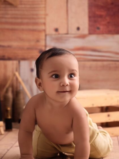 A curious upward glance from our little cowboy, capturing a moment of wonder and innocence during his photoshoot.