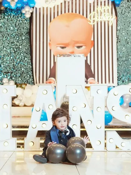 We know how much effort goes into the details. We make sure to capture the amazing themed decor you've planned, like these large, lit-up letters spelling out the birthday boy's name at his fun Boss Baby party.
