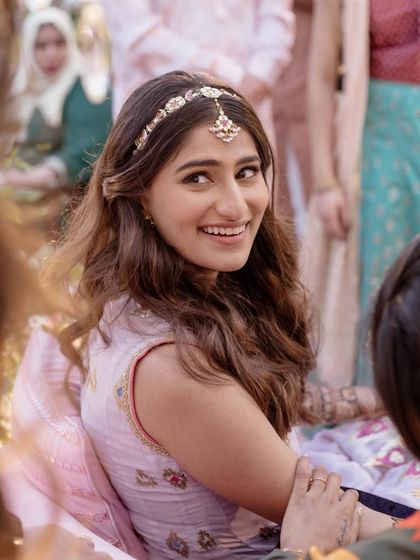 A close-up on the mehendi look, highlighting the delicate matha patti. This is a great way to add a touch of tradition to a modern outfit without it feeling too heavy.