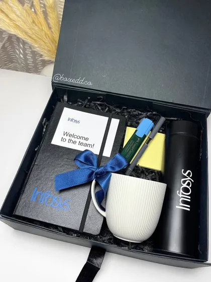 A sleek and professional welcome kit for Infosys. The all-black theme includes a branded notebook, bottle, and mug, creating a cohesive and impressive first impression for new team members.