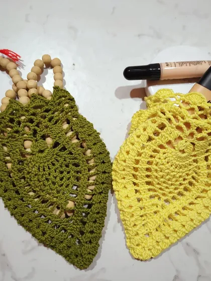 Another use for these versatile sachets. The green one is holding prayer beads, while the yellow one holds some makeup.