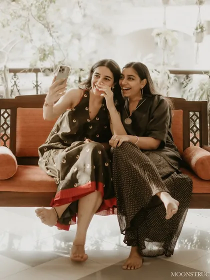 A quick selfie of us, Nandini and Shivangi, during a client's at-home mehendi. We believe in building friendships and working as co-believers in your vision, making the entire styling journey a shared, joyful experience.