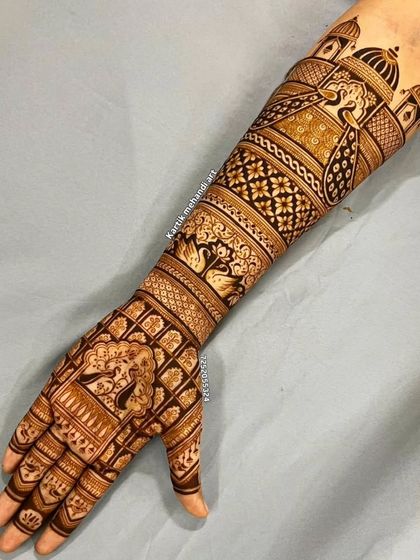 A full-arm traditional design with a royal feel. It features a baraat procession with elephants and a bride in a jharokha, surrounded by intricate jaali and floral patterns.