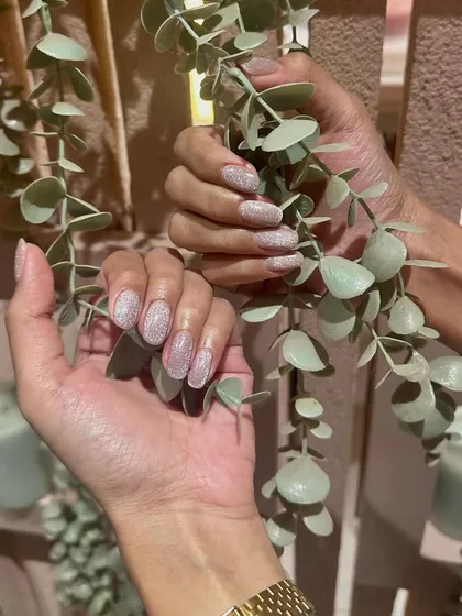 Experience the sparkle with our huge range of glitter polishes. This client chose a beautiful, reflective pink glitter for a fun and glamorous look.