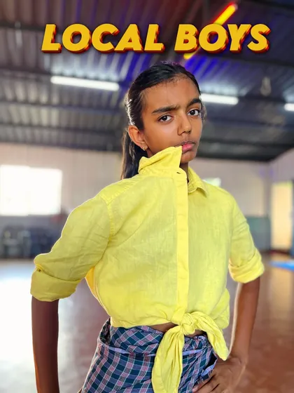 Attitude and style. This "Local Boys" cover shot captures the confident and playful personality we encourage our dancers to bring to their South Indian folk performances.