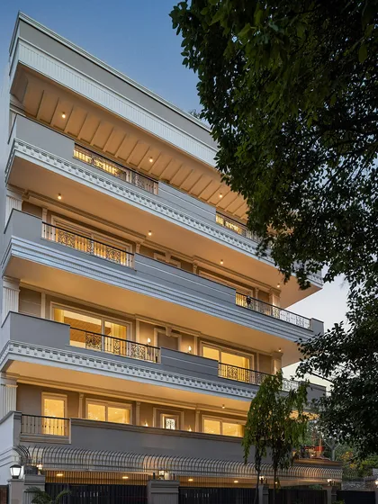 The facade of the KAIRA residence in South Delhi, a project defined by its carefully curated neo-classical elements. We used intricate mouldings and motifs to create a distinguished presence on a busy urban street.