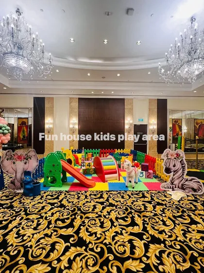 A grand rainbow play area set up in an elegant banquet hall. The vibrant colors of the play zone create a stunning contrast with the formal decor, showing our versatility.