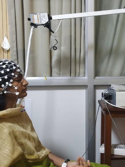 A side view of the EEG setup during the NIMHANS research. I believe integrating yoga with modern medicine is crucial, and I am happy to contribute to research that provides substantial, scientific results.