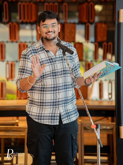 A poet gestures while performing at the "Love Without Labels" meetup. The theme brought out powerful stories of identity and acceptance.
