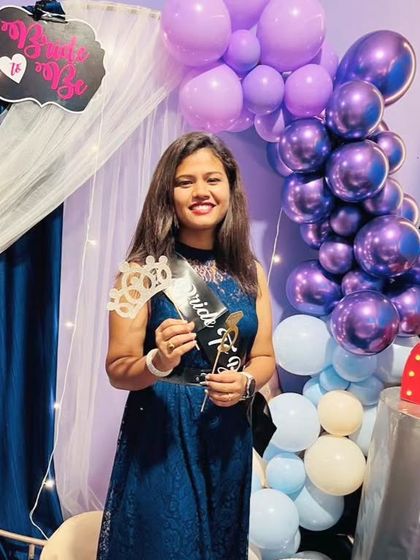 Posing with all the fun props. I provide a 'Bride to Be' sash, a crown, and other fun items to make the guest of honor feel special.