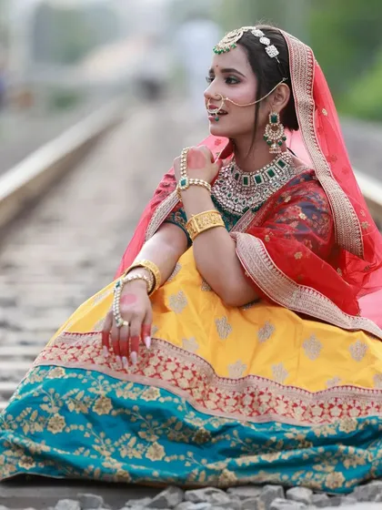 Another perspective from our railway track shoot. This side profile shot emphasizes the model's pose and the traditional nose ring, adding to the cinematic feel of the series.