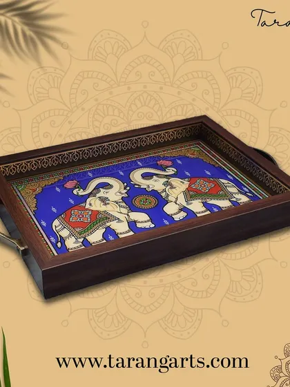 This hand-painted glass tray, featuring majestic elephants, is one of our most popular gifting items. It perfectly blends functionality with the royal charm of Indian art, making it an ideal gift for weddings, housewarmings, or corporate events.