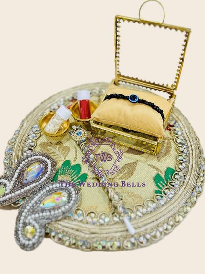 We've introduced these utterly beautiful Rakhi trays with the prettiest detailing. This one features a classic design with a glass box for the rakhi.