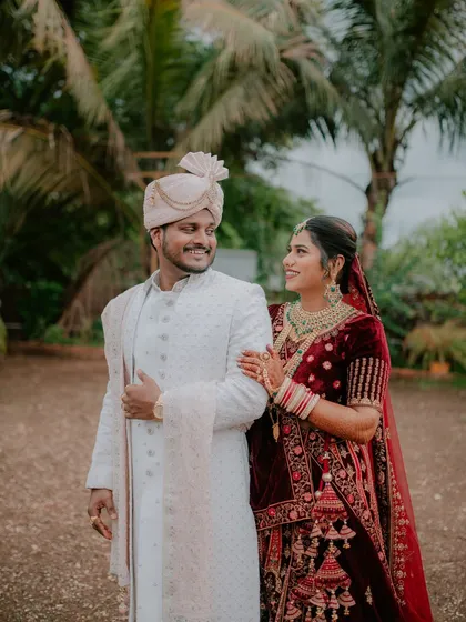 A candid and happy moment between the couple during their outdoor reception photoshoot.