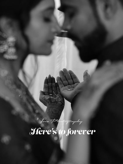 A black and white version of the couple holding their rings. The monochrome edit adds a timeless and artistic feel to this symbolic gesture.